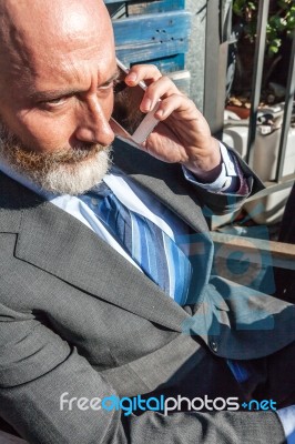 Bearded Businessman With Working Outside The Office Stock Photo