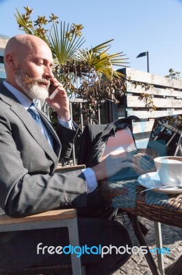 Bearded Businessman With Working Outside The Office Stock Photo