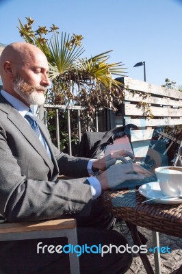 Bearded Businessman With Working Outside The Office Stock Photo