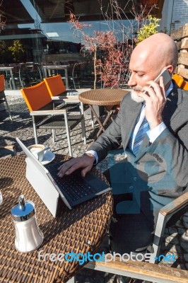 Bearded Businessman With Working Outside The Office Stock Photo