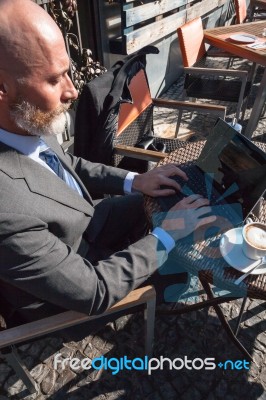 Bearded Businessman With Working Outside The Office Stock Photo