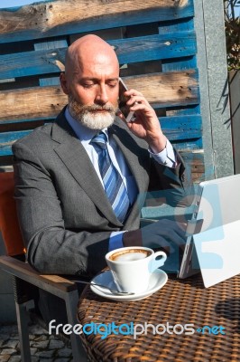 Bearded Businessman With Working Outside The Office Stock Photo