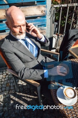 Bearded Businessman With Working Outside The Office Stock Photo