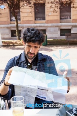 Bearded Man Looking At The Map Stock Photo