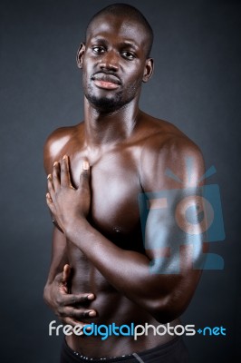 Beautiful And Muscular Man In Dark Background Stock Photo