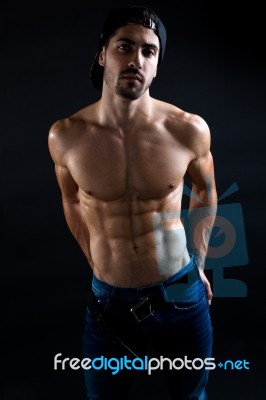 Beautiful And Muscular Man In Dark Background Stock Photo