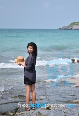 Beautiful Asian Girl Smiling At The Beach Stock Photo