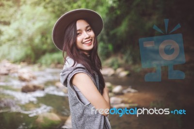 Beautiful Asian Woman Smiling Around The Nature Green And Water Stock Photo