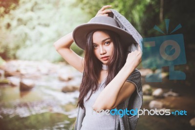 Beautiful Asian Woman Smiling Around The Nature Green And Water Stock Photo