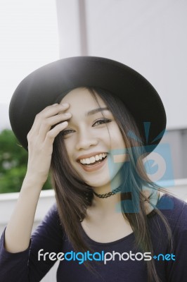 Beautiful Asian Young Woman Smiling On The City Stock Photo