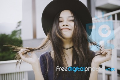 Beautiful Asian Young Woman Smiling On The City Stock Photo