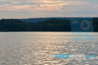 Beautiful Background With The Lake And The Forest On The Sunset Stock Photo