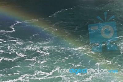 Beautiful Background With The Water Near Amazing Niagara Falls With A Rainbow Stock Photo