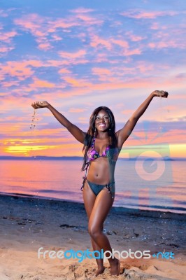 Beautiful Black African American Woman Posing On The Beach At Su… Stock Photo