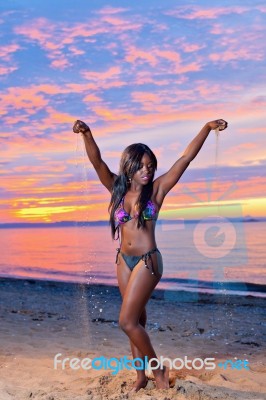 Beautiful Black African American Woman Posing On The Beach At Su… Stock Photo