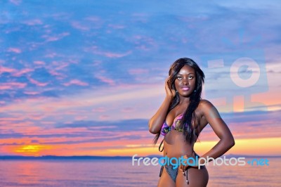 Beautiful Black African American Woman Posing On The Beach At Su… Stock Photo