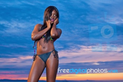 Beautiful Black African American Woman Posing On The Beach At Su… Stock Photo