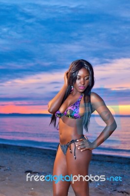 Beautiful Black African American Woman Posing On The Beach At Su… Stock Photo