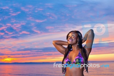 Beautiful Black African American Woman Posing On The Beach At Su… Stock Photo