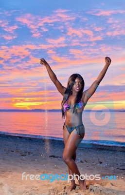 Beautiful Black African American Woman Posing On The Beach At Su… Stock Photo