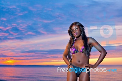 Beautiful Black African American Woman Posing On The Beach At Su… Stock Photo