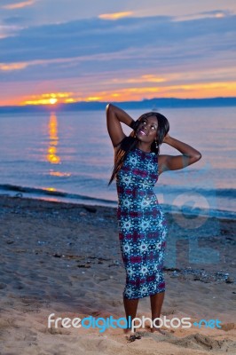 Beautiful Black African American Woman Posing On The Beach At Su… Stock Photo