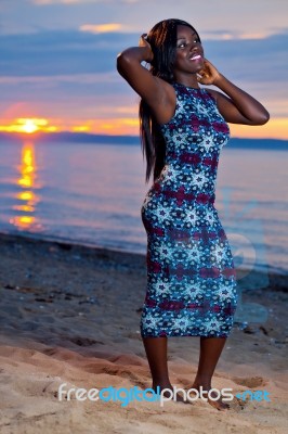 Beautiful Black African American Woman Posing On The Beach At Su… Stock Photo