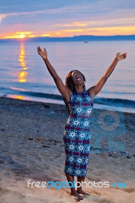 Beautiful Black African American Woman Posing On The Beach At Su… Stock Photo