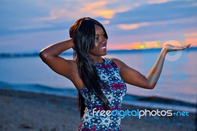 Beautiful Black African American Woman Posing On The Beach At Su… Stock Photo