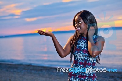 Beautiful Black African American Woman Posing On The Beach At Su… Stock Photo