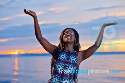 Beautiful Black African American Woman Posing On The Beach At Su… Stock Photo