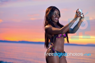 Beautiful Black African American Woman Posing On The Beach At Su… Stock Photo