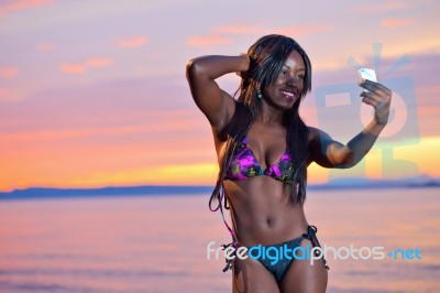 Beautiful Black African American Woman Posing On The Beach At Su… Stock Photo