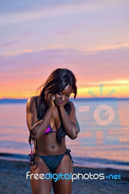 Beautiful Black African American Woman Posing On The Beach At Su… Stock Photo