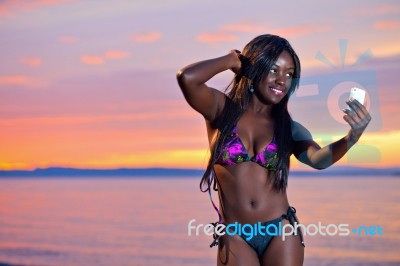 Beautiful Black African American Woman Posing On The Beach At Su… Stock Photo