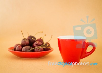 Beautiful Breakfast Of Red Coffee Cup And Cherries Stock Photo