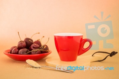 Beautiful Breakfast Of Red Coffee Cup And Cherries Stock Photo