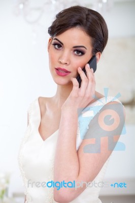 Beautiful Bride And Mobile Phone Stock Photo