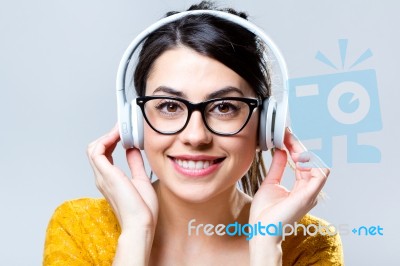 Beautiful Brunette Woman Listening To Music Stock Photo