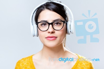 Beautiful Brunette Woman Listening To Music Stock Photo