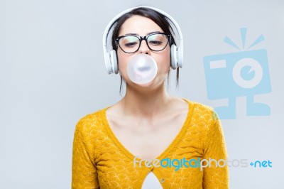 Beautiful Brunette Woman Listening To Music Stock Photo