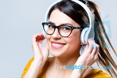 Beautiful Brunette Woman Listening To Music Stock Photo