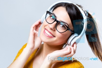 Beautiful Brunette Woman Listening To Music Stock Photo