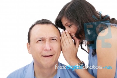 Beautiful Brunette Woman Whispering Into Her Boyfriends Ear Stock Photo