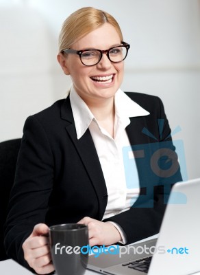 Beautiful Businesswoman Holding Coffee Cup Stock Photo