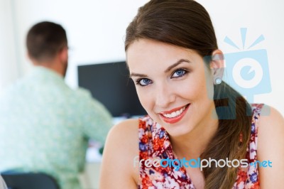 Beautiful Businesswoman Posing At Camera In Office Stock Photo