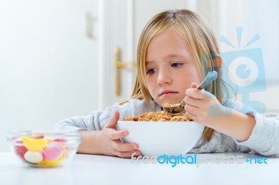 Beautiful Child Having Breakfast At Home Stock Photo