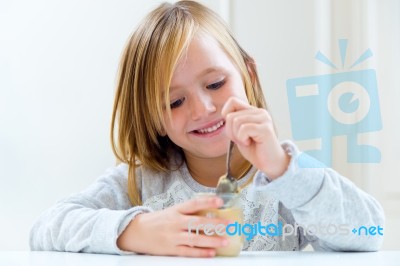 Beautiful Child Having Breakfast At Home Stock Photo