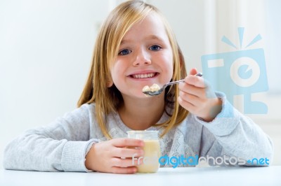 Beautiful Child Having Breakfast At Home Stock Photo