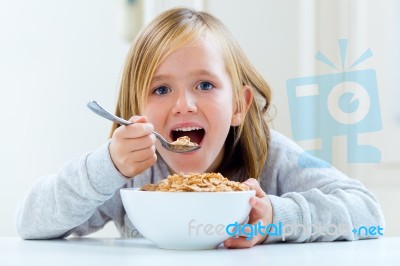 Beautiful Child Having Breakfast At Home Stock Photo